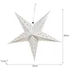 A white paper star lantern with cutouts of stars and moons, suspended by a string. Dimensions are indicated by measurement lines. Podgląd zdjęcia produktu
