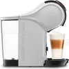 A white Nescafé Dolce Gusto coffee machine with a water tank and a glass of latte macchiato. Produktbild-Vorschau