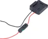 A black adapter with red and black wires and a switch, isolated on a white background. Produktbild-Vorschau