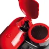 A close-up view of a red espresso machine with its lid open, revealing a black coffee tamper inside. Produktbild-Vorschau