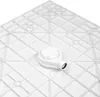 A close-up, top-down view of a white shower tray with a white drain assembly. The tray has a grid-like pattern underneath for support. Produktbild-Vorschau