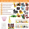 A flat lay image showcasing the contents of a safari jungle craft kit, including felt animal shapes, accessories, thread, needles, stuffing, and instructions. Produktbild-Vorschau