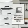 A stack of white plastic drawers with a graphic overlay highlighting features. Produktbild-Vorschau