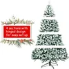 A disassembled artificial Christmas tree with snow-like flocking, shown in sections, with a text overlay highlighting its features. Produktbild-Vorschau