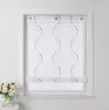 A white window with a sheer curtain featuring a wavy embroidered pattern. A small bouquet of white flowers in a teal pot sits on a white surface to the left. Produktbild-Vorschau