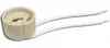 A ceramic light socket with two white wires attached, isolated on a white background. Podgląd zdjęcia produktu