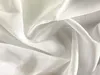 A close-up, draped view of white sheer fabric with subtle vertical lines. Produktbild-Vorschau