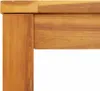 A close-up view of the corner of a wooden table. Anteprima dell’immagine prodotto