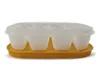 A Tupperware ice cube tray with a lid and an orange base, shown against a white background. Produktbild-Vorschau