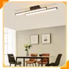 A modern dining room with a table, chairs, and a ceiling light. Podgląd zdjęcia produktu