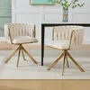 Two beige velvet dining chairs with gold metal legs are shown in a dining room setting. Produktbild-Vorschau