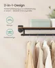 A wall-mounted coat rack with a shelf above, displaying clothing items hanging from the rack. Produktbild-Vorschau