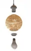 An exploded view of a pendant light fixture, showing its components: the socket, the bamboo lampshade, and the light bulb. Produktbild-Vorschau