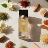 A perfume bottle surrounded by its aromatic ingredients. Produktbild-Vorschau
