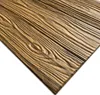 A close-up, diagonal view of dark wood-look foam panels. Náhled obrázku produktu
