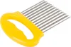 A yellow and silver wavy vegetable cutter on a white background. Podgląd zdjęcia produktu