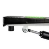 Close-up view of the side of a stepper machine, focusing on the pedal and hydraulic cylinder. Produktbild-Vorschau