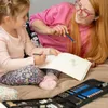 A woman and a child are drawing in a sketchbook. Náhled obrázku produktu