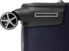 A close-up view of the wheel and upper corner of a dark blue suitcase. Náhled obrázku produktu