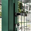 A close-up view of a green metal garden gate with a black handle and a key in the lock. Produktbild-Vorschau