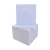 A stack of light gray acoustic panels with one panel standing upright on top. Podgląd zdjęcia produktu