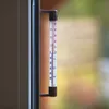 A thermometer attached to a window frame, showing the temperature outdoors. Podgląd zdjęcia produktu
