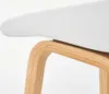 A close-up view of the connection between the seat and the base of a stool. Náhled obrázku produktu