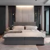 A modern bedroom with a large bed as the focal point. Produktbild-Vorschau