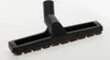 A black vacuum cleaner attachment with brown bristles is placed on a white background. Produktbild-Vorschau