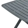 A close-up view of a gray plastic garden table with a slatted surface and a folded leg. Náhled obrázku produktu