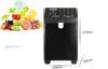 A black fructose dispenser is shown next to a collage of fresh fruits and juices. Produktbild-Vorschau