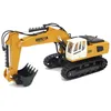 A yellow and white toy excavator is shown on a white background. Náhľad obrázku produktu