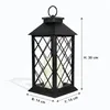A black lantern with two LED candles inside, shown against a white background with dimensions indicated. Produktbild-Vorschau
