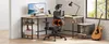 A home office setup with a desk, chair, computer, and guitar. Náhled obrázku produktu