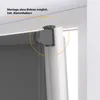 A close-up view of a roller blind mounting system attached to a window frame. Produktbild-Vorschau