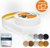 A roll of white flexible skirting board with yellow adhesive tape on the back, shown partially unrolled, with a set of color swatches below. Anteprima dell’immagine prodotto