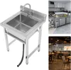 A stainless steel sink with a faucet and a drain hose, shown on a white background. The image is part of a collage with other images of a kitchen and a restaurant. Náhled obrázku produktu