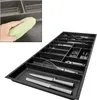 A hand is cleaning a drawer insert with a green cloth, and a drawer insert filled with cutlery is shown. Produktbild-Vorschau