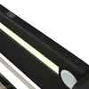 Close-up view of a black bed frame with integrated LED lighting and a USB port. Náhľad obrázku produktu