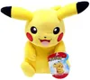 A plush toy of the character Pikachu from Pokémon, sitting and holding a tag. Voir les images du produit