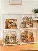 Four miniature dollhouse scenes are displayed in clear plastic cases, stacked two by two. Podgląd zdjęcia produktu