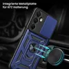 A close-up of a blue and black phone case with a ring holder, attached to a car vent mount. Produktbild-Vorschau
