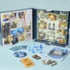 A Cluedo advent calendar with its components laid out on a light blue surface. Produktbild-Vorschau