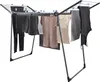 A drying rack with clothes hanging on it. Produktbild-Vorschau