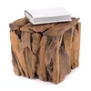 A white book rests on a rustic wooden cube stool. Produktbild-Vorschau