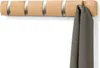 A wooden coat rack with five hooks is mounted on a white wall, with a gray scarf hanging from one of the hooks. Podgląd zdjęcia produktu
