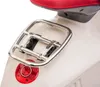 Close-up of the rear of a white scooter, showing the luggage rack and tail light. Podgląd zdjęcia produktu