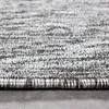 A close-up view of the texture and edge of a carpet. Produktbild-Vorschau