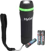 A black HyCell mini LED flashlight with a green band and a wrist strap, shown with two AAA batteries and one AAA battery lying next to it. Podgląd zdjęcia produktu