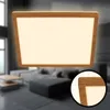 A modern living room with a sofa and coffee table, illuminated by a ceiling lamp. Produktbild-Vorschau